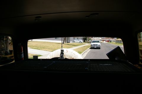 1986 Ford Bronco - Looking out from inside a vehicle at a street scene with two other vehicles visible.