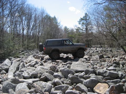 1991 Ford Bronco - This 1991 Ford Bronco navigates a challenging rocky terrain, its off-road capabilities.