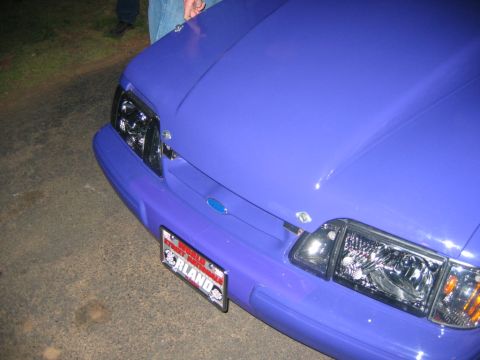 1992 Ford Mustang - Front view of a purple 1992 Ford Mustang, showing its distinctive headlights and grille.