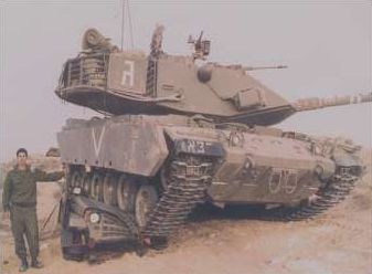 1994 Ford Bronco - A man stands next to a large tank in a desert-like environment.