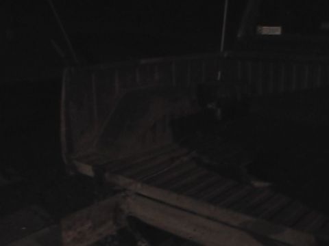 1980 Dodge Magnum - The interior of a truck bed is visible in this dark photograph, with a watermark for Supermotors.net.