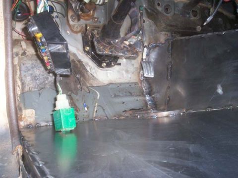 1982 Toyota 4Runner - Custom metal work on the interior floor of a vehicle, including a fuse box and wiring.