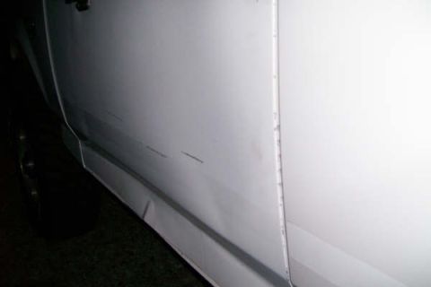 1992 Ford C-350 (Centurion Conversions) - Looks like rubbed on on something, also the panel below the door was crushed, apparently by someone not familiar with how to operate a gara…