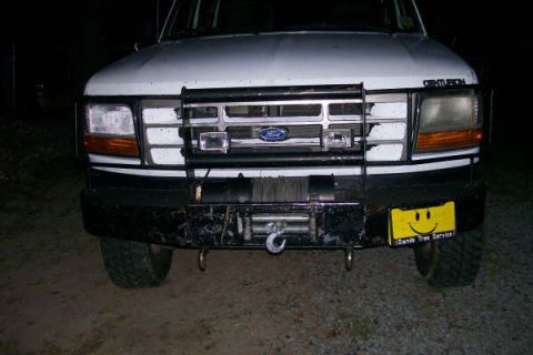 1992 Ford C-350 (Centurion Conversions) - This truck features a prominent winch and a custom bumper with auxiliary lighting.