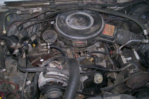 1992 Ford C-350 (Centurion Conversions) - A close-up view of a vehicle's engine compartment, showing various components and wiring.
