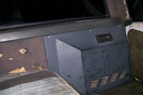 1992 Ford C-350 (Centurion Conversions) - Close-up of an interior panel with vents and a vent above, showing wear and tear.