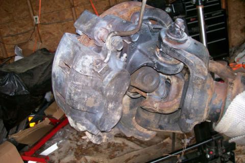 1988 Ford Bronco - Close-up of a Dana 60 front axle assembly, showing its components and condition.
