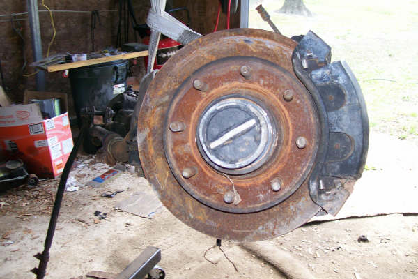 Dana 60 front axle hub and rotor assembly, appears rusty