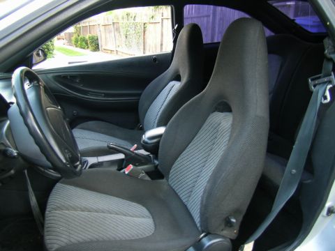 1993 Ford Probe - Interior of a 1993 Ford Probe, bucket seats and a manual transmission shifter.