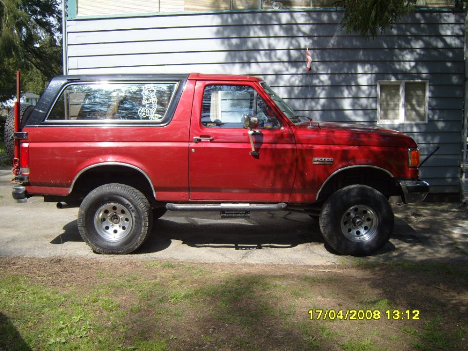 Red 1989 Ford Bronco side view