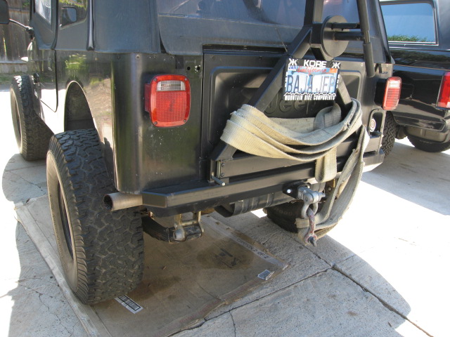 Black Jeep CJ7 rear bumper with spare tire mount and strap