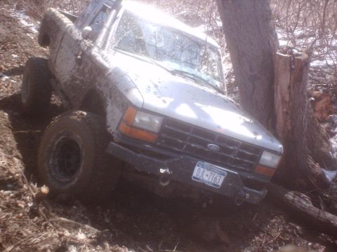 1990 Ford Ranger - This 1990 Ford Ranger is stuck in the mud on a steep, wooded hill.