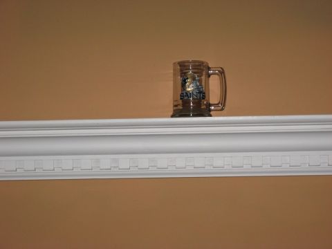 2006 Ford F-150 - A glass mug with the New Orleans Saints logo and text is displayed on a shelf.