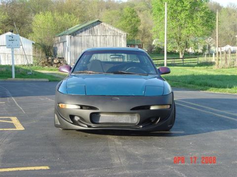 1993 Ford Probe - This teal car is seen from the front, partially covered by a black protective shroud. The image is dated April 17, 2008.