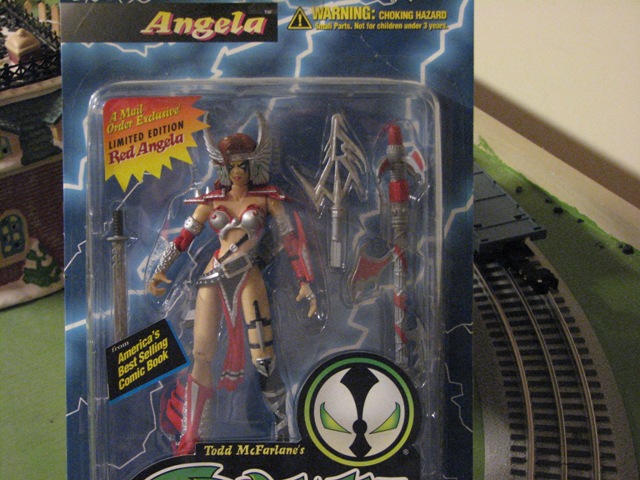 Angela action figure in packaging with sword and axe accessories