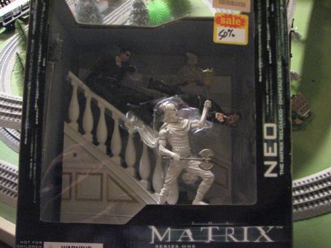 1991 Ford Bronco - The Matrix Neo action figure set is shown in its original packaging with a 50% off sale sticker.