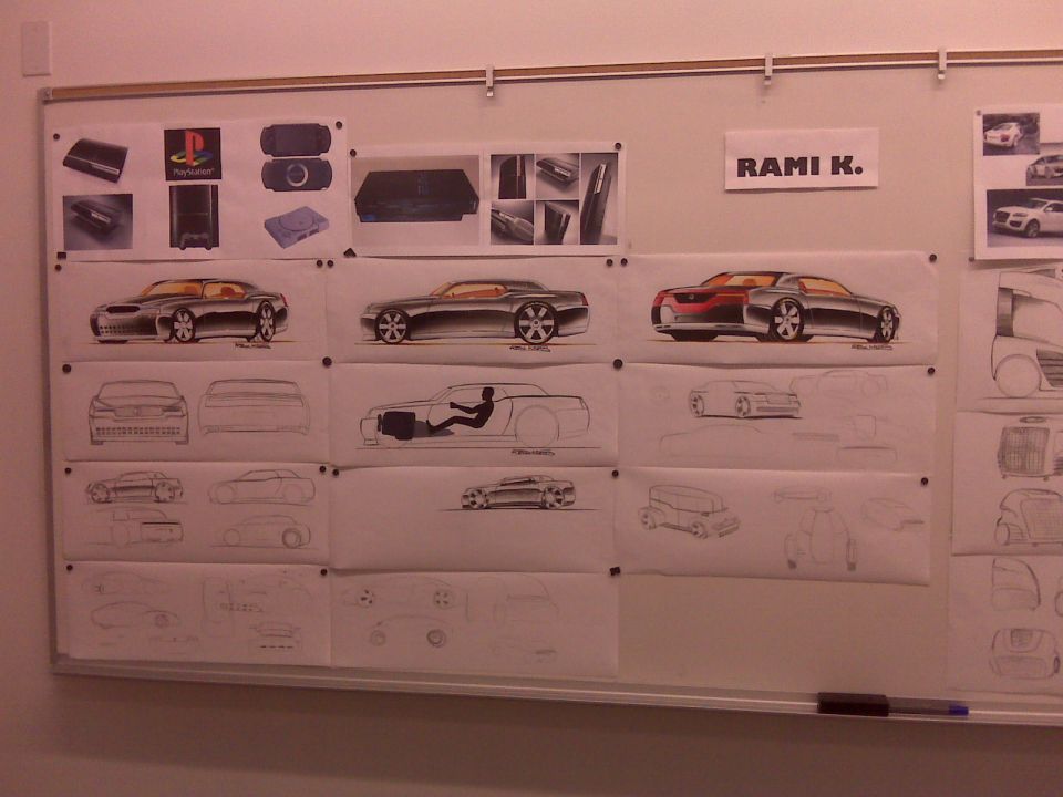 Car design sketches and product images on a whiteboard