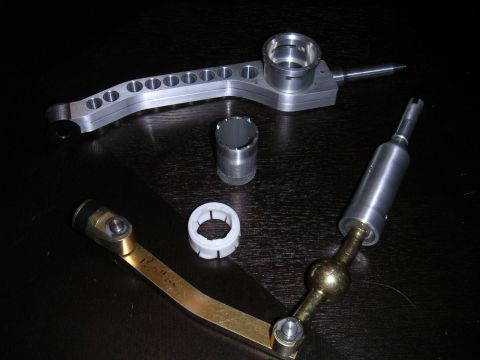 2002 BMW M3 - Aftermarket short shifter components shown, including the main lever and linkage parts.