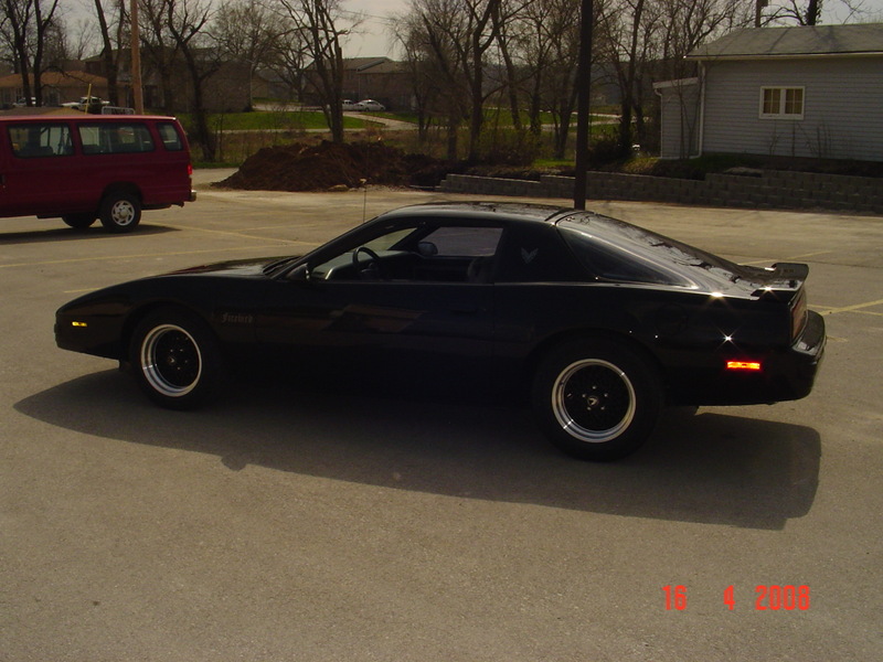 Black 1989 Pontiac Firebird parked on asphalt