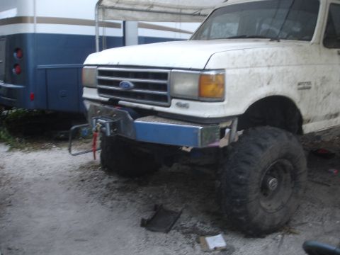 1989 Ford Bronco - Front view of a white 1989 Ford Bronco equipped with a winch mount.