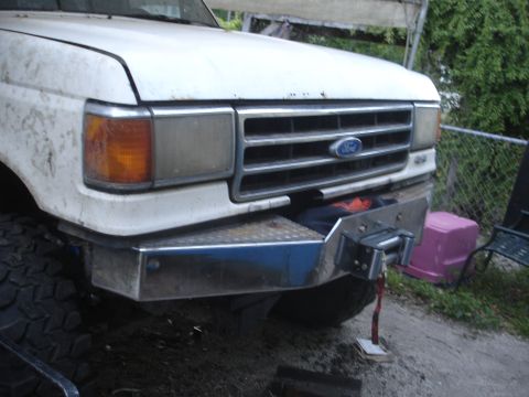1989 Ford Bronco - Front view of a Ford F-Series truck, showing the grille and a custom winch bumper.