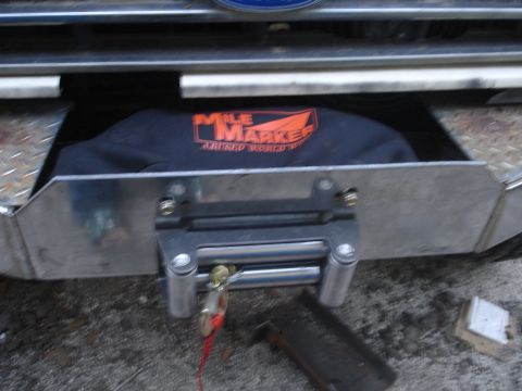 1989 Ford Bronco - Close-up of a winch mount with a Mile Marker bag visible.