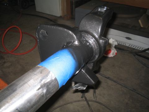 1979 Ford Bronco - Axle housing painted black, with blue tape marking a section of the metal tube.