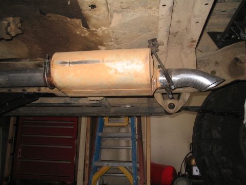 1979 Ford Bronco - Custom exhaust modification on a vehicle, showing the muffler and tailpipe assembly.