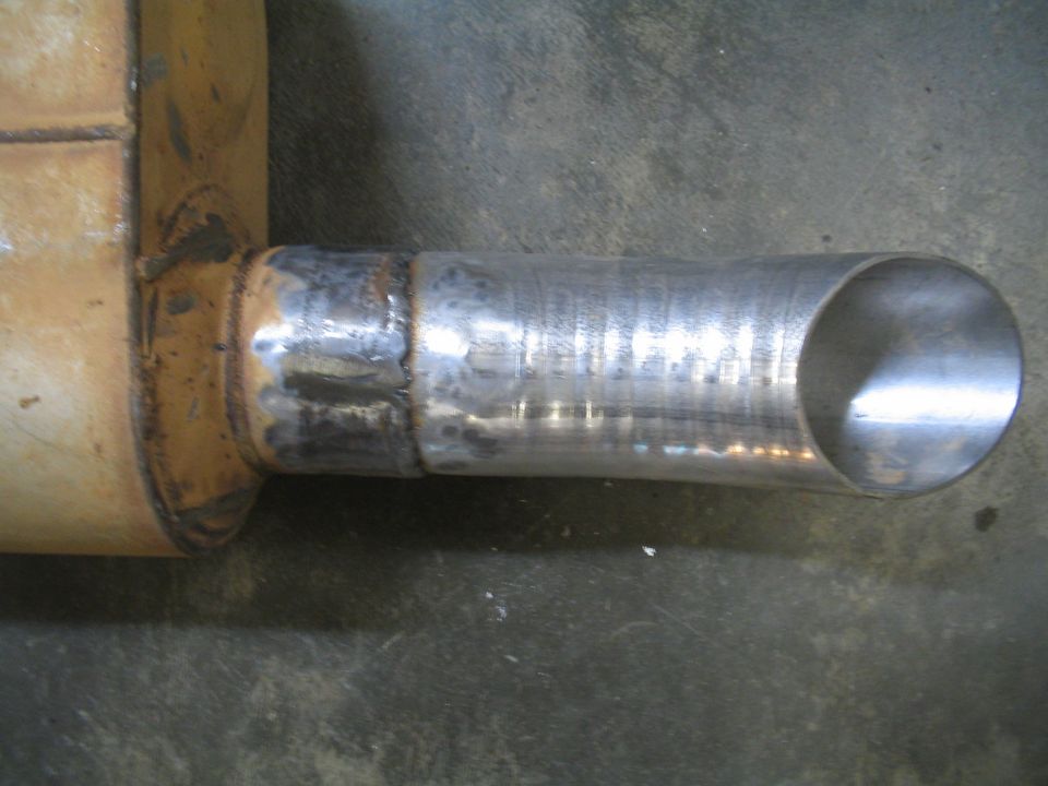 Exhaust pipe with a welded extension and a cut end