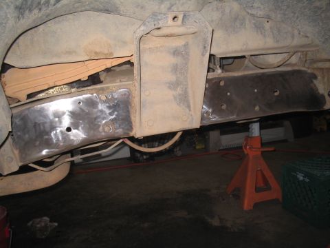 1979 Ford Bronco - Frame repair work in progress on a vehicle, showing welded patches and structural components.