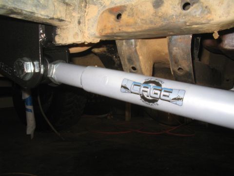 1979 Ford Bronco - Close-up of an off-road shock absorber the CAGE PRODUCTS logo.
