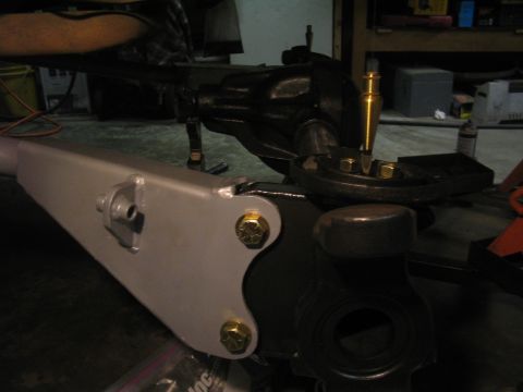 1979 Ford Bronco - Close-up of a vehicle's suspension part, likely a differential housing with a custom bracket attached.