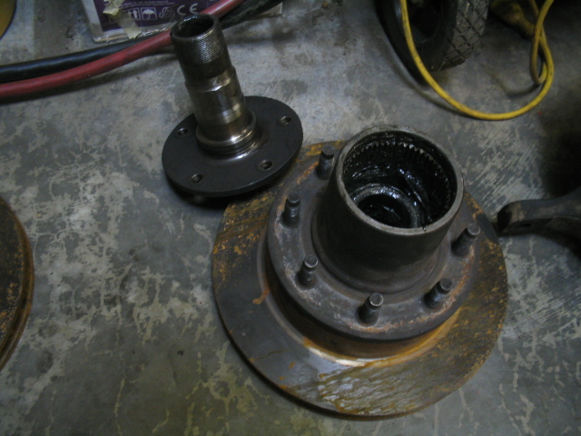 Wheel hub assembly and brake rotor with grease inside the hub