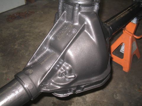 1979 Ford Bronco - Close-up of a differential housing, possibly from a Ford Bronco, showing casting marks and a metal tag.