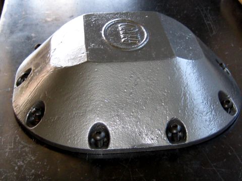 1996 Ford Bronco - Differential cover with an embossed logo, likely for a Ford vehicle.