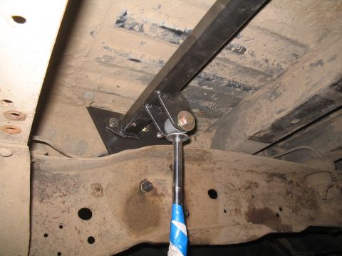 1979 Ford Bronco - Undercarriage view of a vehicle's frame and suspension system.
