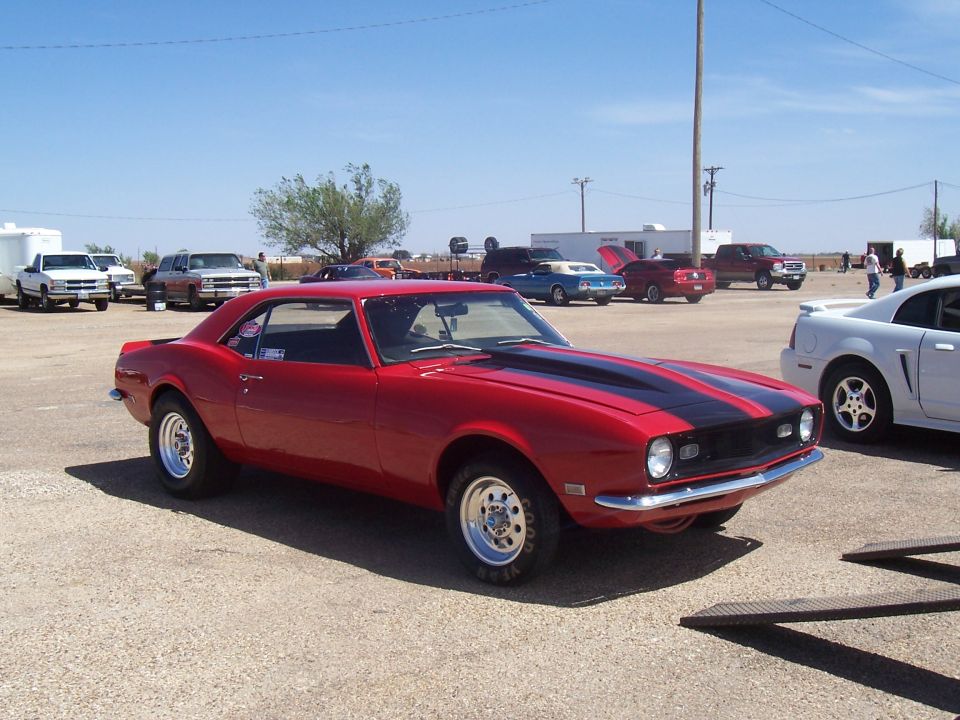 Red 1967 Chevrolet Camaro with black stripes, 3q-front view