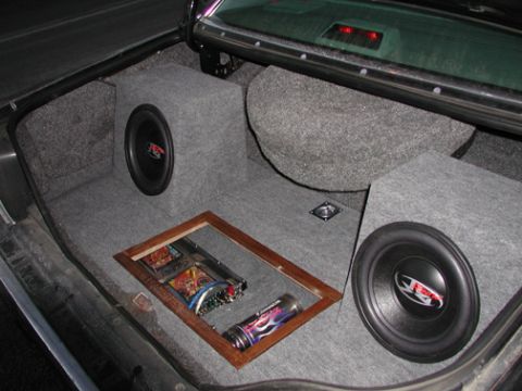 1988 Ford LTD Crown Victoria - Custom trunk install with two Rockford Fosgate subwoofers in carpeted boxes and an amplifier in a plexiglass window.