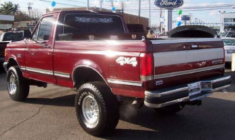 1991 Ford F-150 - This 1991 Ford F-150 pickup truck is shown from a three-quarter front angle.