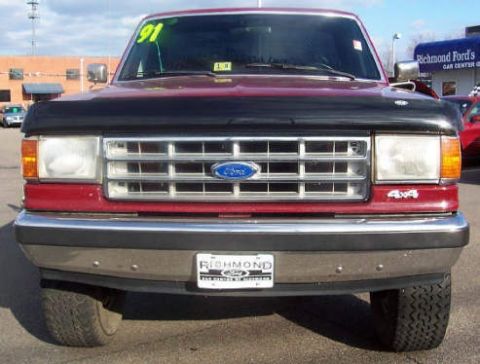 1991 Ford F-150 - Front view of a 1991 Ford F-150, showing the grille, headlights, and bumper.