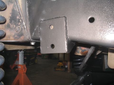 1979 Ford Bronco - A custom bracket is attached to the vehicle's frame, showing a modification to the suspension system.