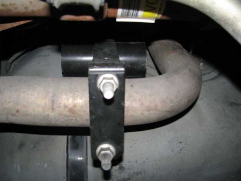 2003 Mercury Marauder - Undercarriage view of an exhaust pipe and its mounting bracket.