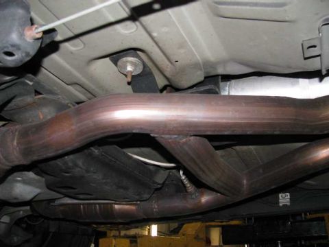 2003 Mercury Marauder - Undercarriage view showing exhaust pipes and suspension components, with 'SUPERMOTORS.NET' visible in the lower right corner.