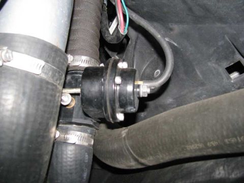 2003 Mercury Marauder - Close-up of a black automotive valve assembly with various hoses and metal clamps.