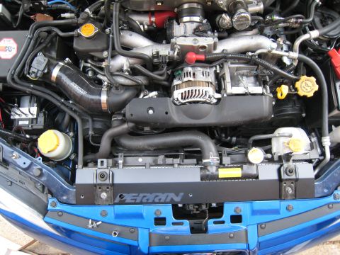 2007 Subaru Impreza - Engine bay detail showing Perrin aftermarket parts installed on a blue vehicle.