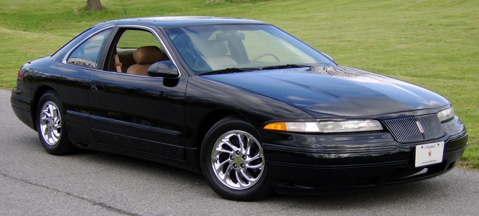 Black Lincoln Mark VIII coupe, 3/4 front view, polished wheels, tan interior