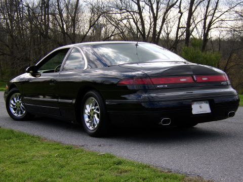 1996 Mercury Grand Marquis - This black Lincoln Mark VIII coupe is shown from the rear 3/4 angle.
