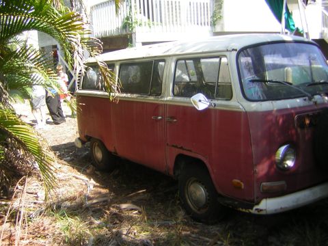 1971 Volkswagen Vanagon - This 1971 Volkswagen Vanagon is seen from a three-quarter front perspective, with its distinctive two-tone red and white paint scheme.