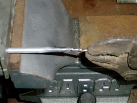 1984 Ford Bronco - deburring line with 7/64" drill bit, chamfer end with file, put clamp in vise to hold line