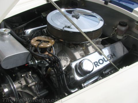 1968 Ford Mustang - Close-up of a modified engine bay, highlighting custom components and performance parts.